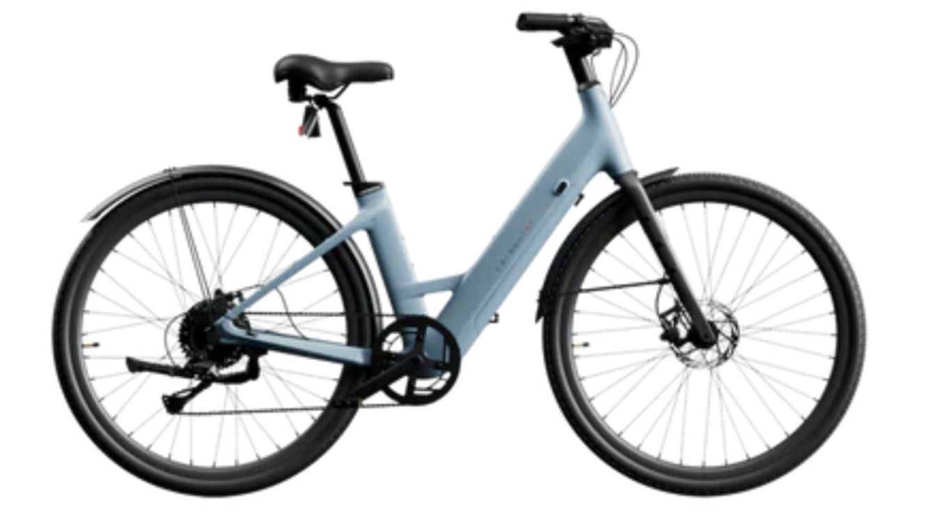 Light blue city bicycle with black tires and rear rack on a white background