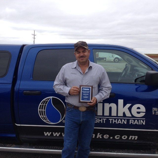 guy holding a blue plaque
