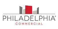 Philadelphia Commercial logo with gray and red building icon and black and red text on white background
