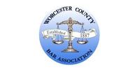 The logo for worcester county bar association has a scale of justice on it.