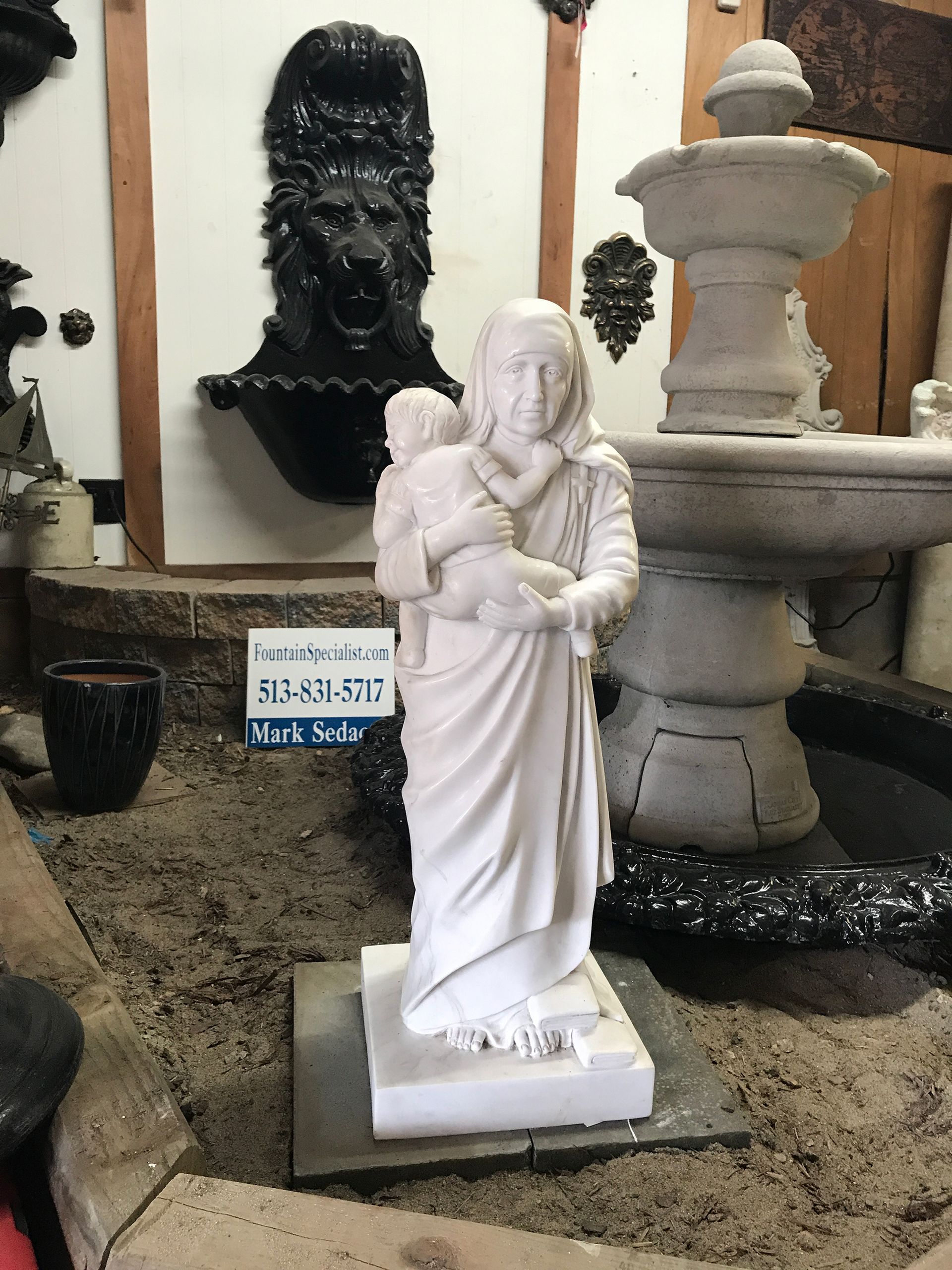 A statue of a woman holding a baby in her arms