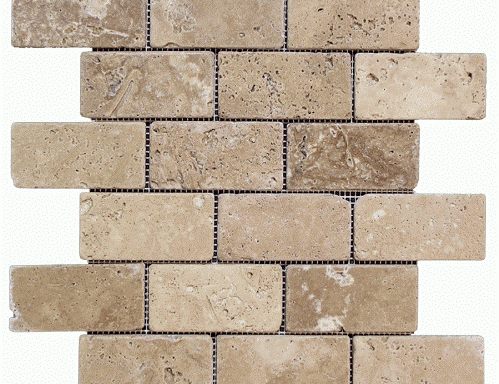A close up of a brick wall with a white background