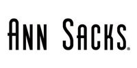 The black logo of the company Ann Sacks featuring the brand name in a tall, sans-serif font followed by a period.