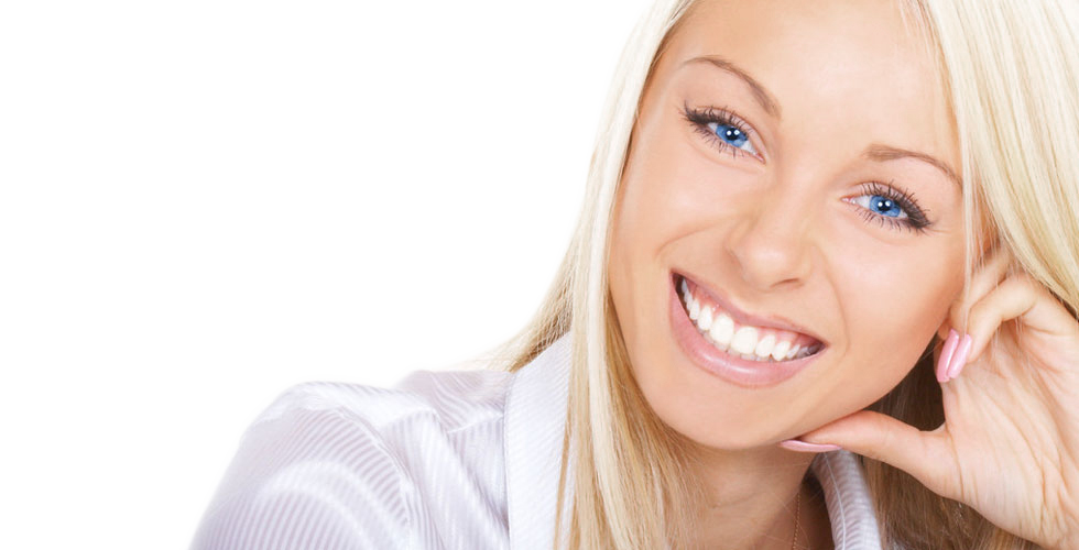 A woman smiling with beautiful teeth