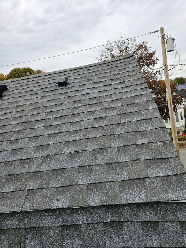 A close up of a roof with shingles on it.
