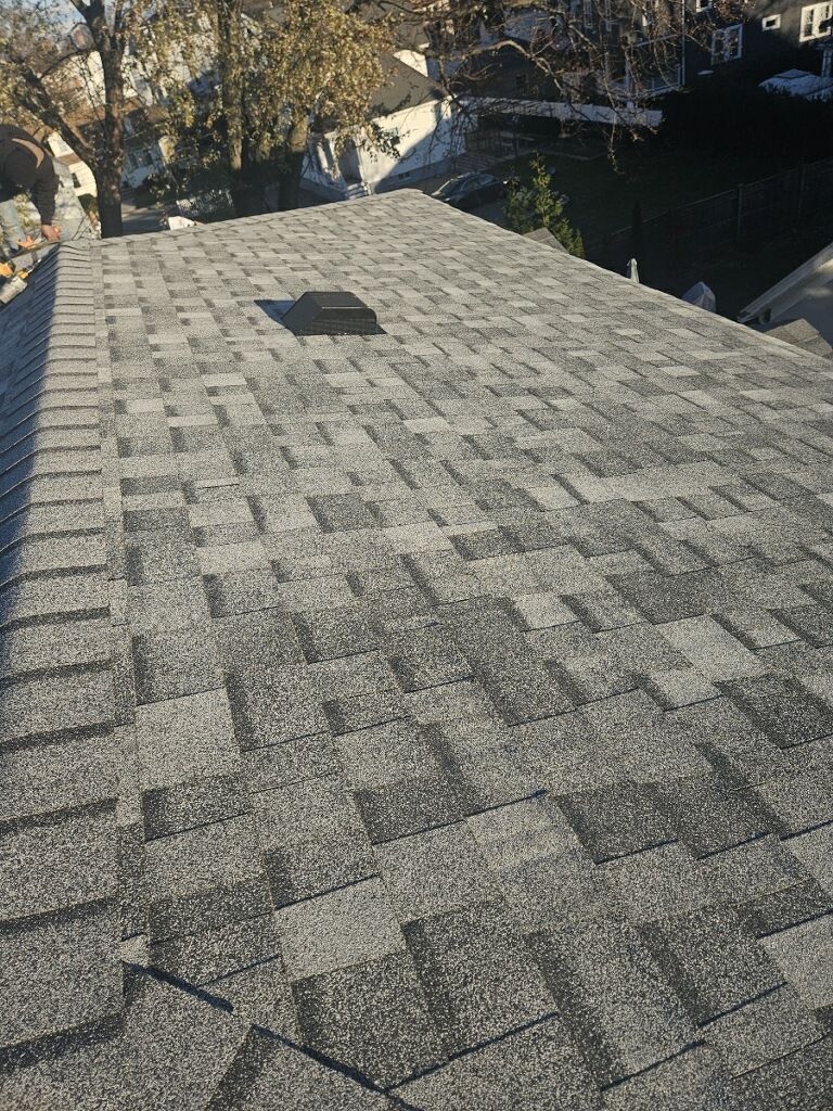 A close up of a roof with shingles on it.