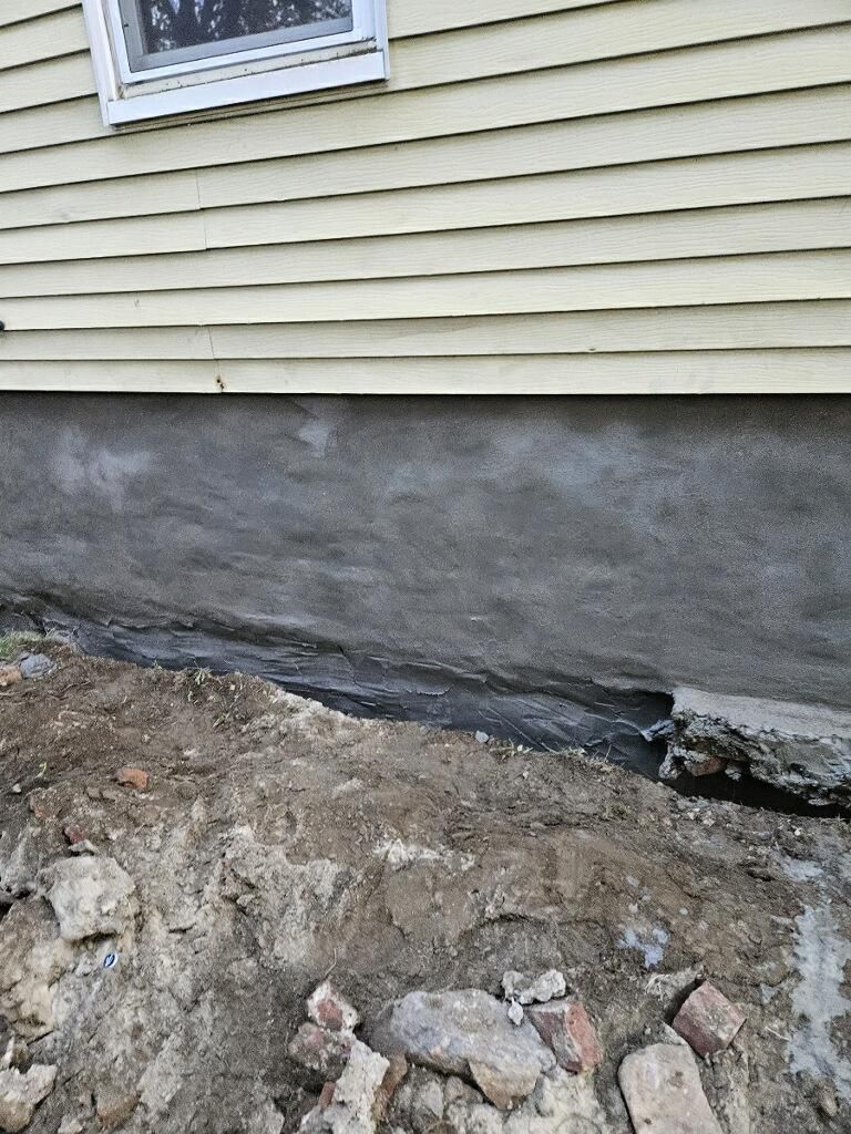 A house with a window on the side of it is being remodeled.