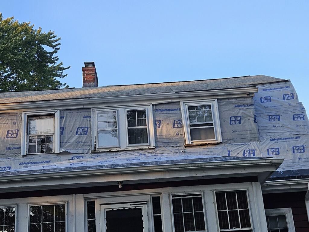 A house with a roof that is being remodeled.