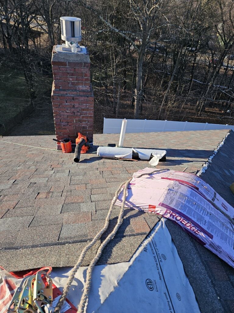 A roof with a chimney and a lot of tools on it.