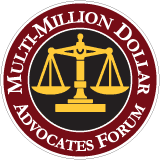 Multimillion Dollar Advocates Forum logo with gold scales on a red circular seal