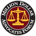 Million Dollar Advocates Forum logo with gold scales on a black circle