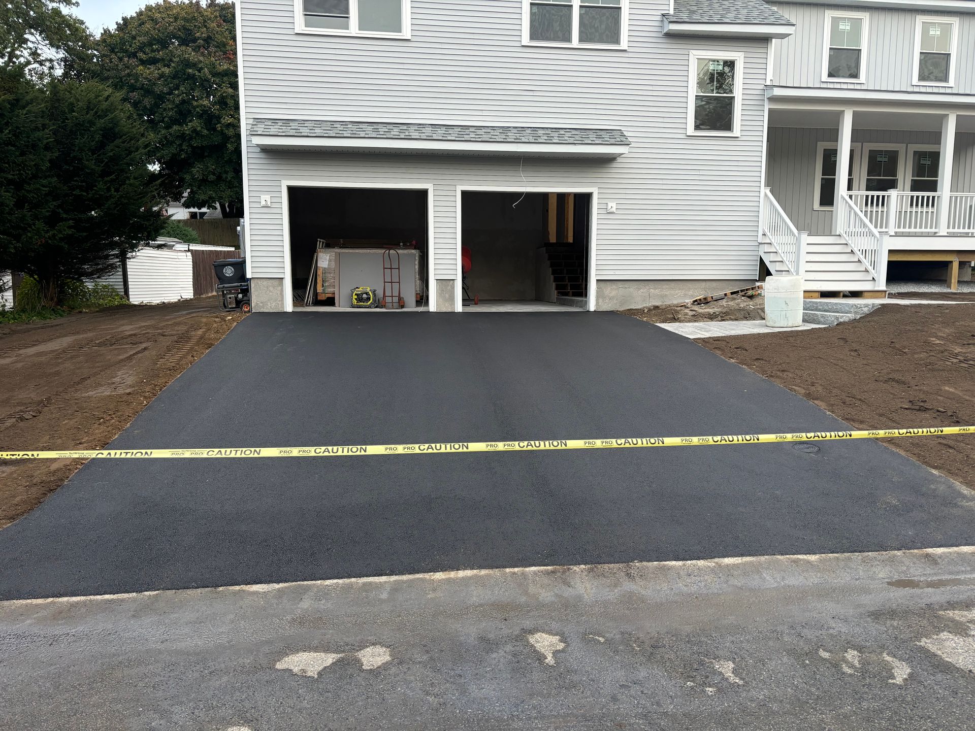 A driveway is being built in front of a house
