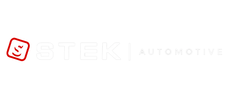 TEKI Automotive logo in white with a red smiling icon on a light background