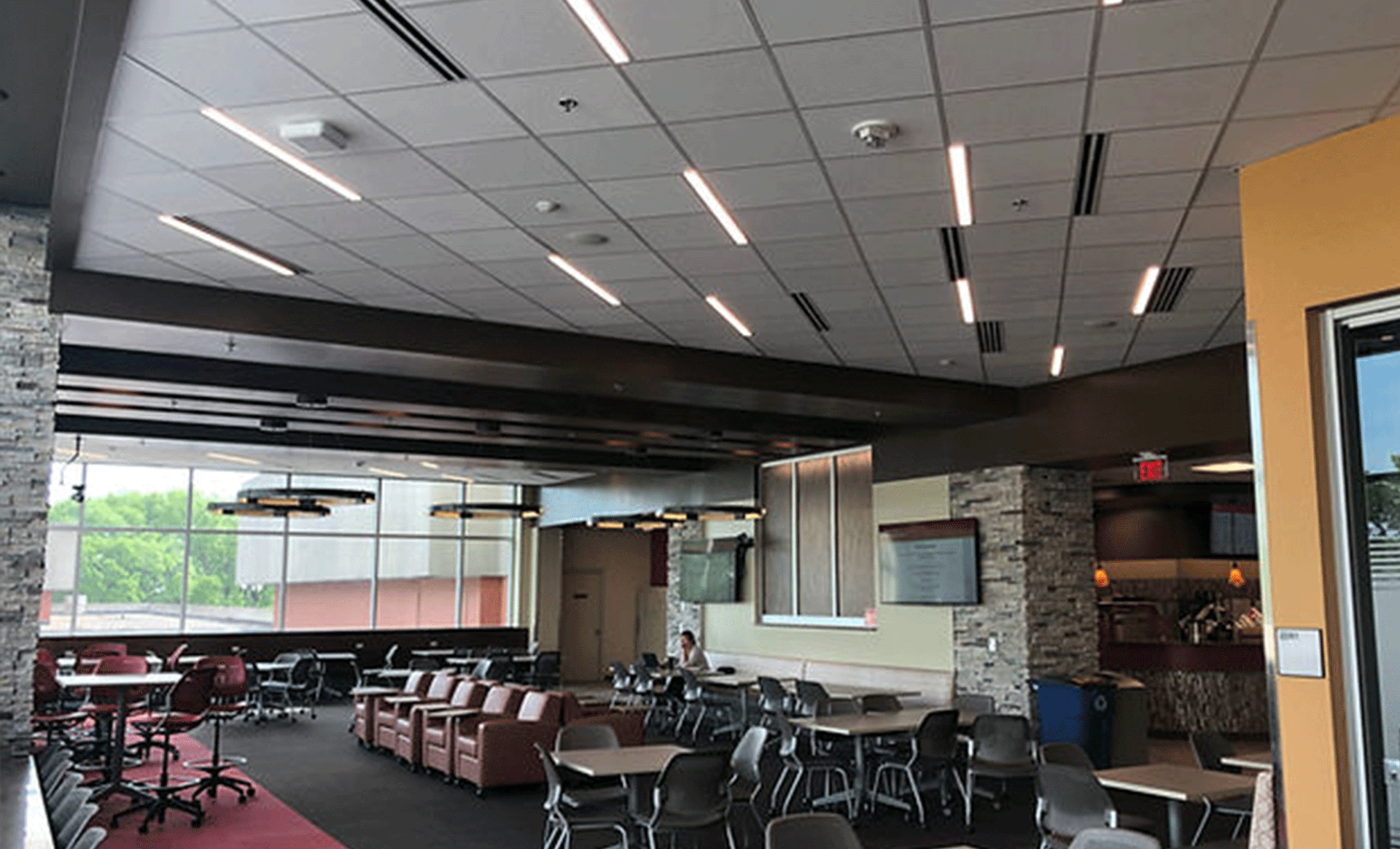 a large room with tables and chairs in it