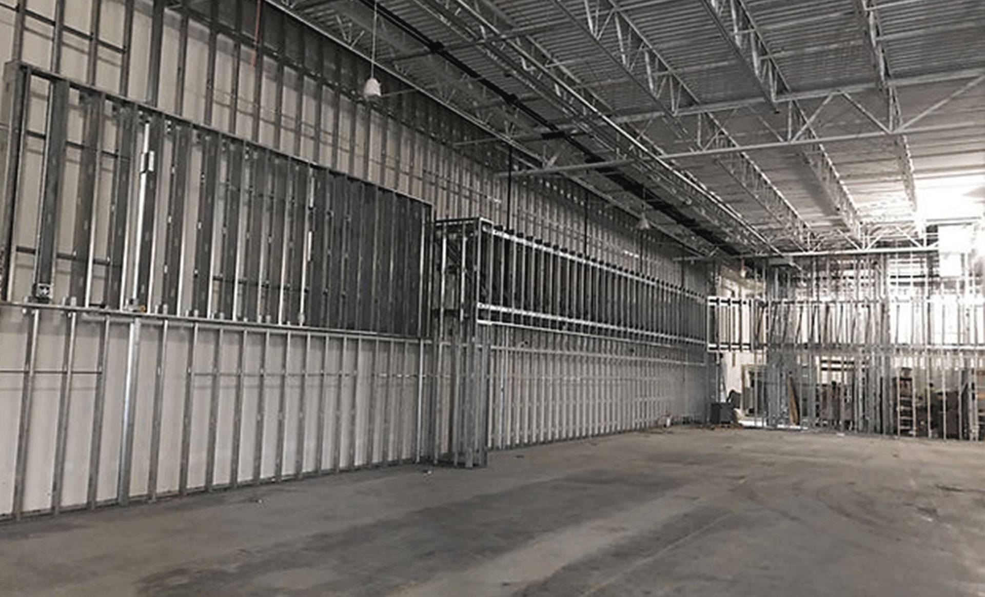 it is a black and white photo of a building under construction .