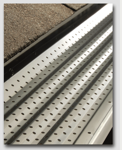 A close up of a metal surface with holes in it