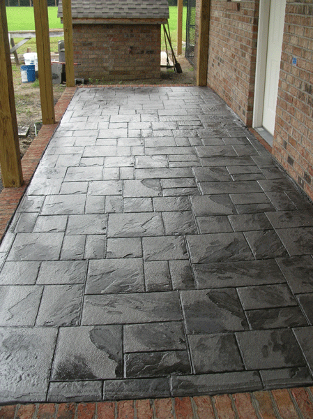 A brick walkway leading to a brick building