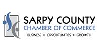 Sarpy County Chamber of Commerce logo with blue and gray abstract shapes.