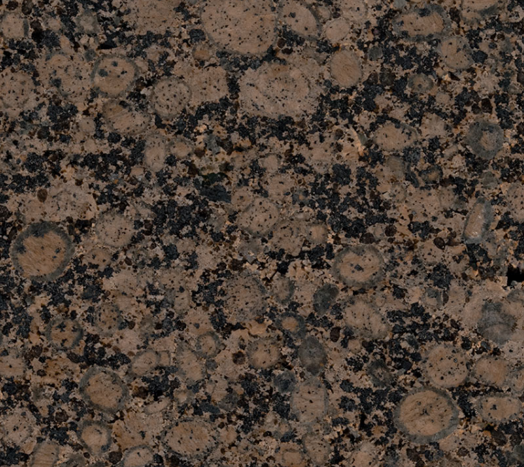 A close up of a brown granite counter top
