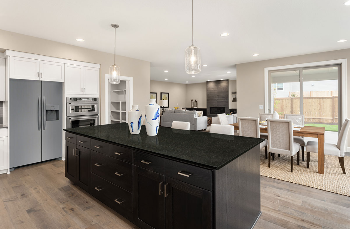 There is a large island in the middle of the kitchen.