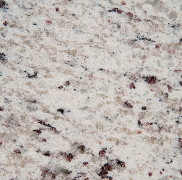 A close up of a white granite counter top