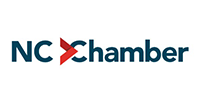 The North Carolina Chamber logo, featuring dark blue text with a red forward-pointing arrow replacing the first C.