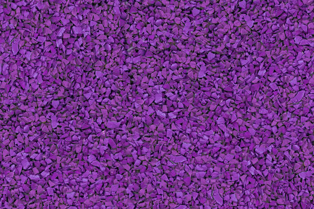 A close-up of a pile of purple gravel.