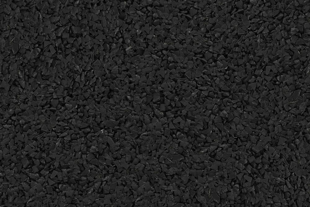 A close up of a pile of black gravel.