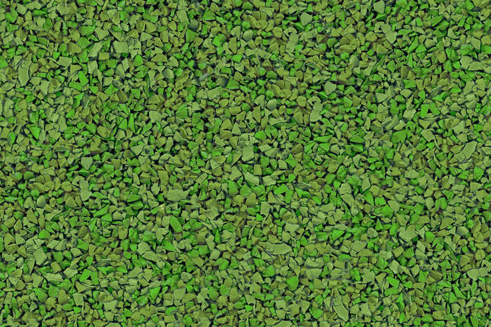 A close up of a pile of green gravel.