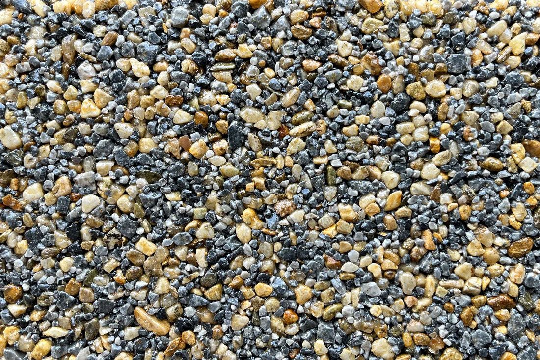 A close up of a pile of gravel that looks like poppy seeds.