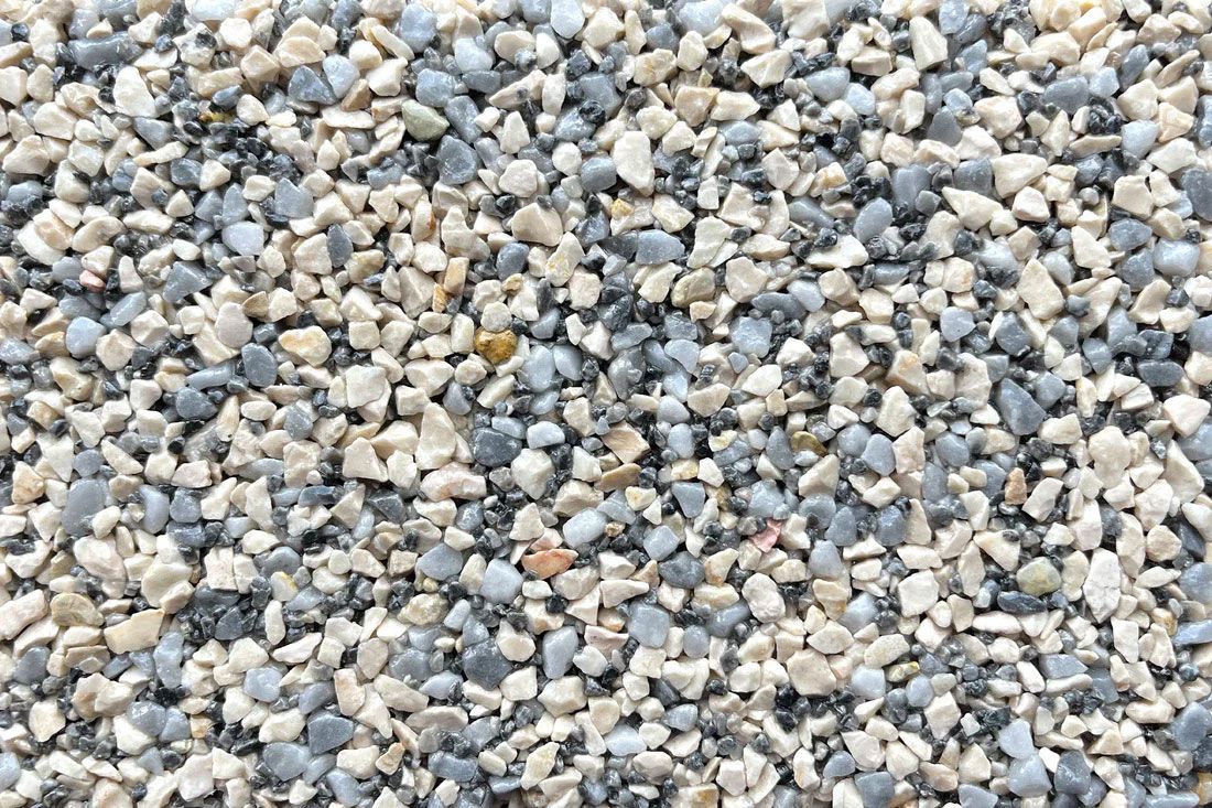 A pile of gravel is sitting on the ground.