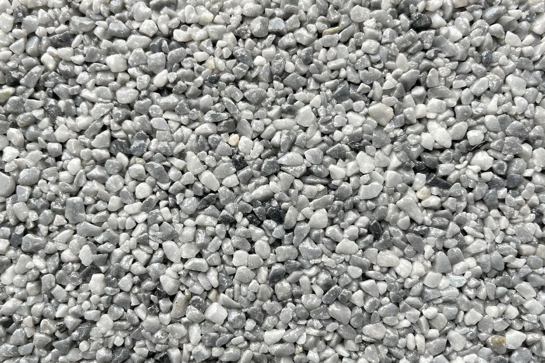 A close up of a pile of gray gravel.