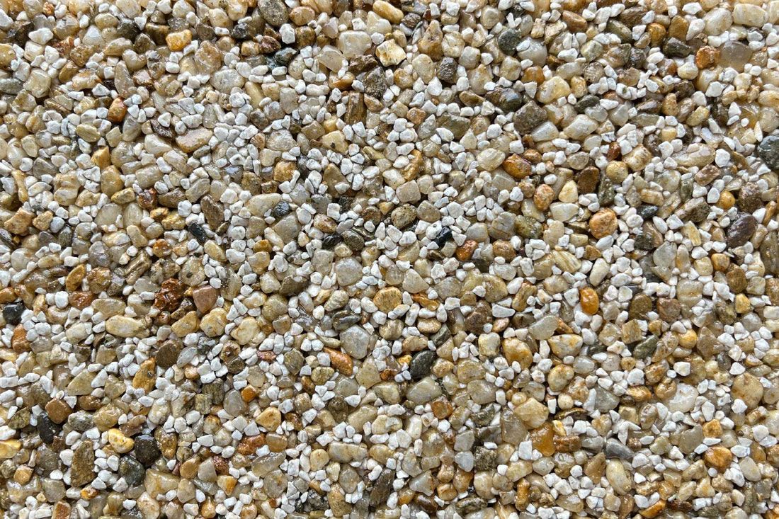 A pile of gravel is sitting on the ground.