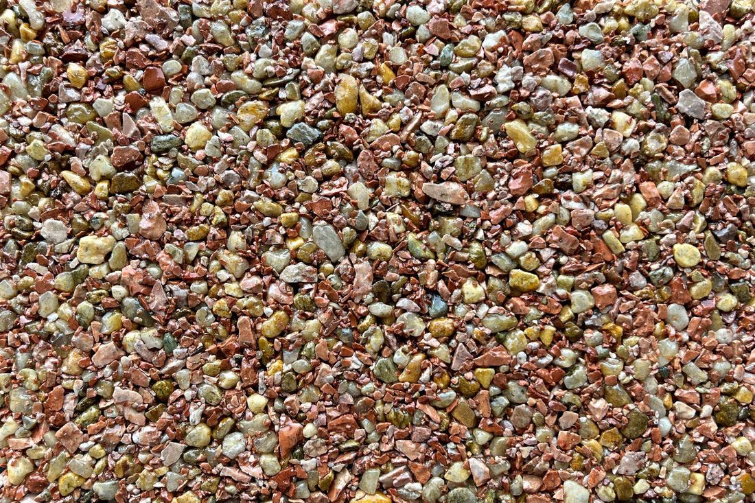 A close up of a pile of rocks on a beach.