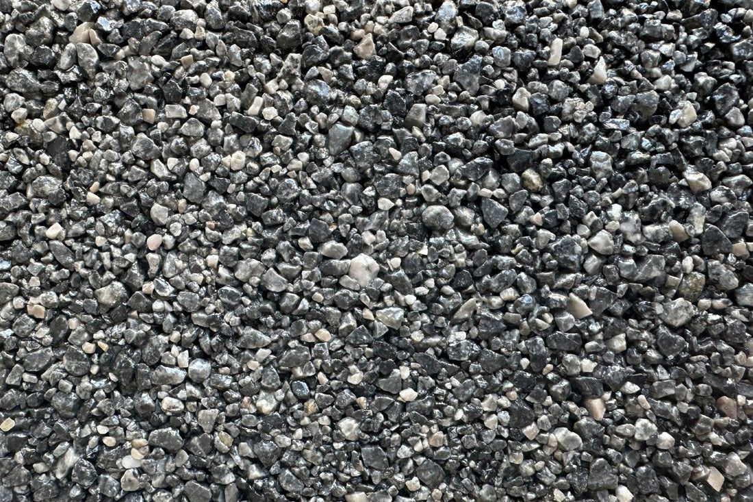 A pile of gravel is sitting on the ground.