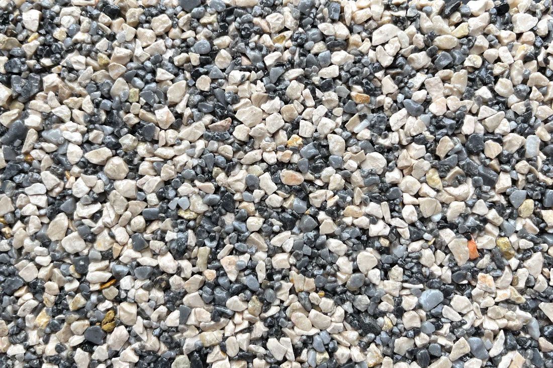 A pile of gravel is sitting on the ground.