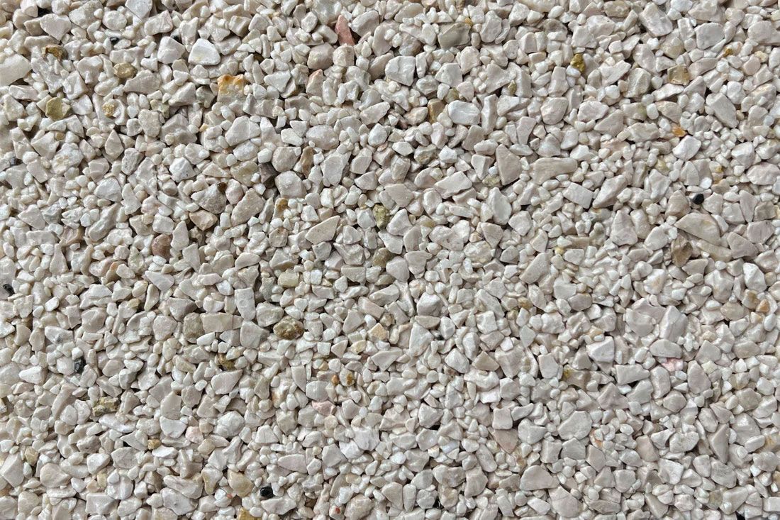 A close up of a pile of white gravel.