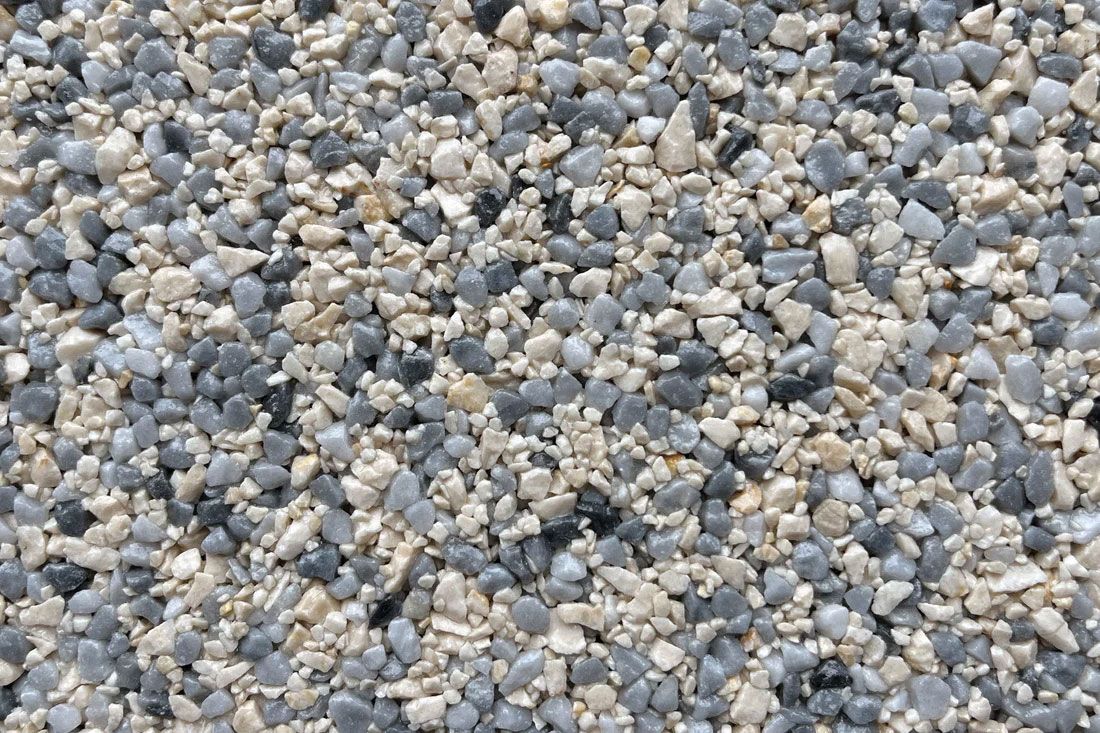 A pile of gravel is sitting on the ground.