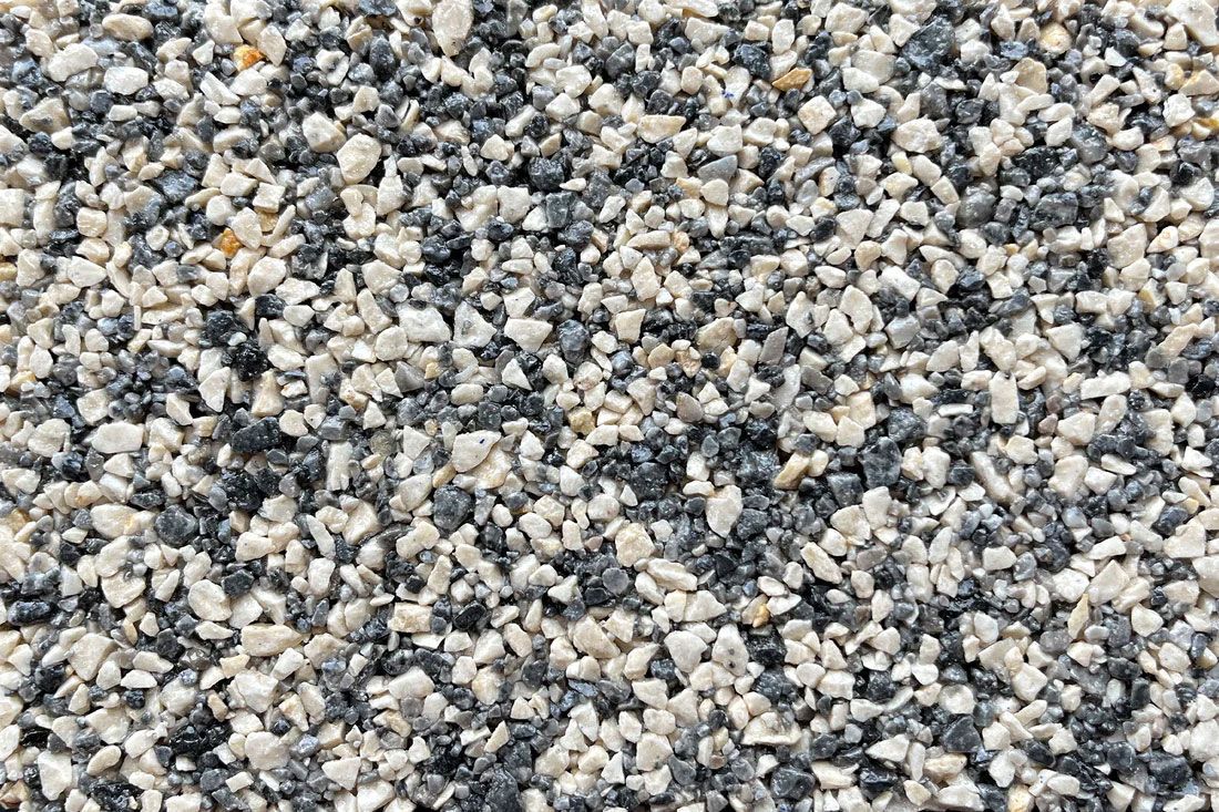 A close up of a pile of black and white gravel.