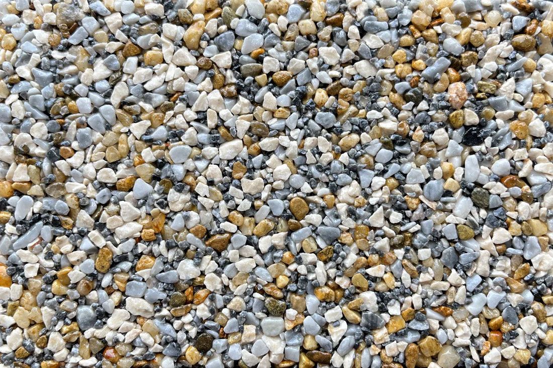 A pile of gravel is sitting on the ground.