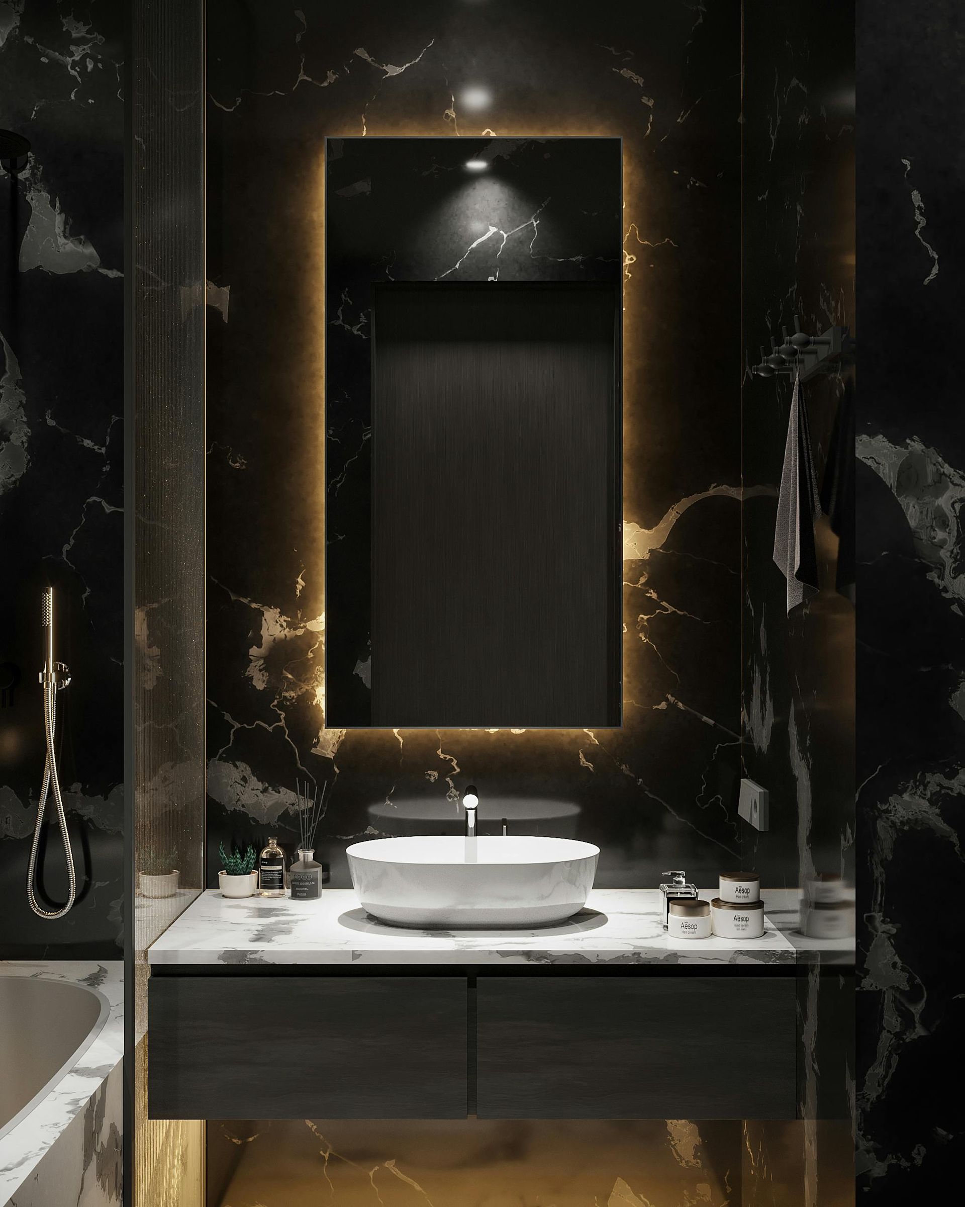 A luxurious bathroom vanity with a white vessel sink on a stone counter against a black marble wall with backlit mirror.