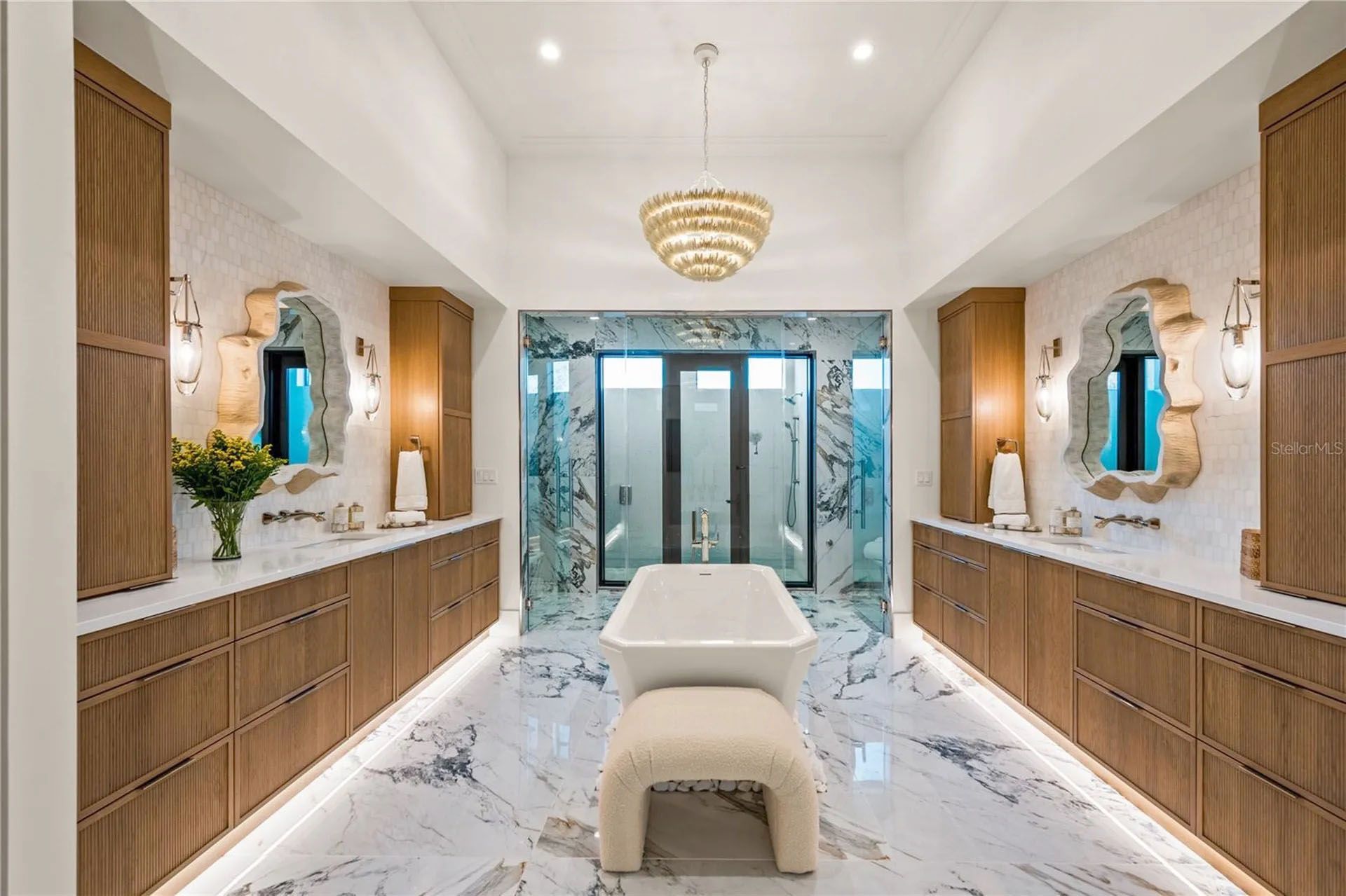 Elegant bathroom with twin vanities, and marble floors