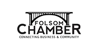 Logo of Folsom Chamber: bridge over the word