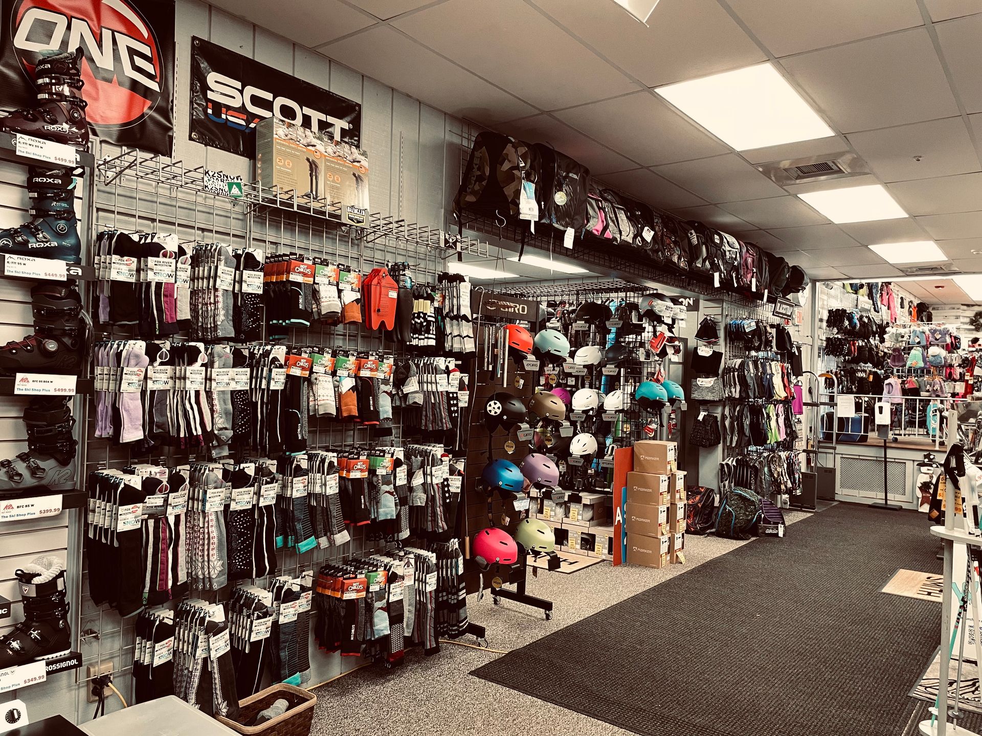 A store filled with lots of bicycle parts and helmets.