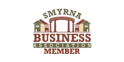 Smyrna Business Association member logo with red and gray text and stylized buildings