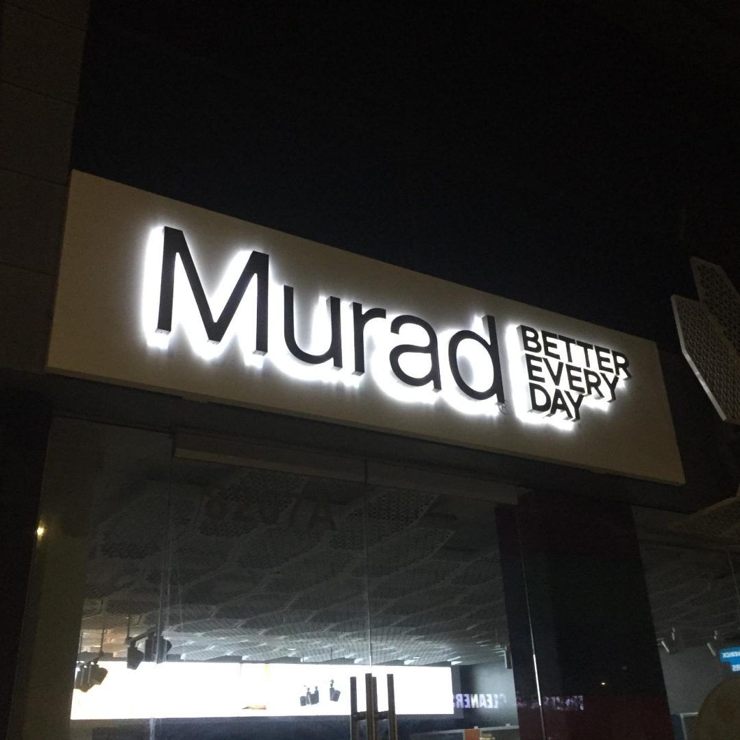 Sign for Murad skincare company: white illuminated letters, 