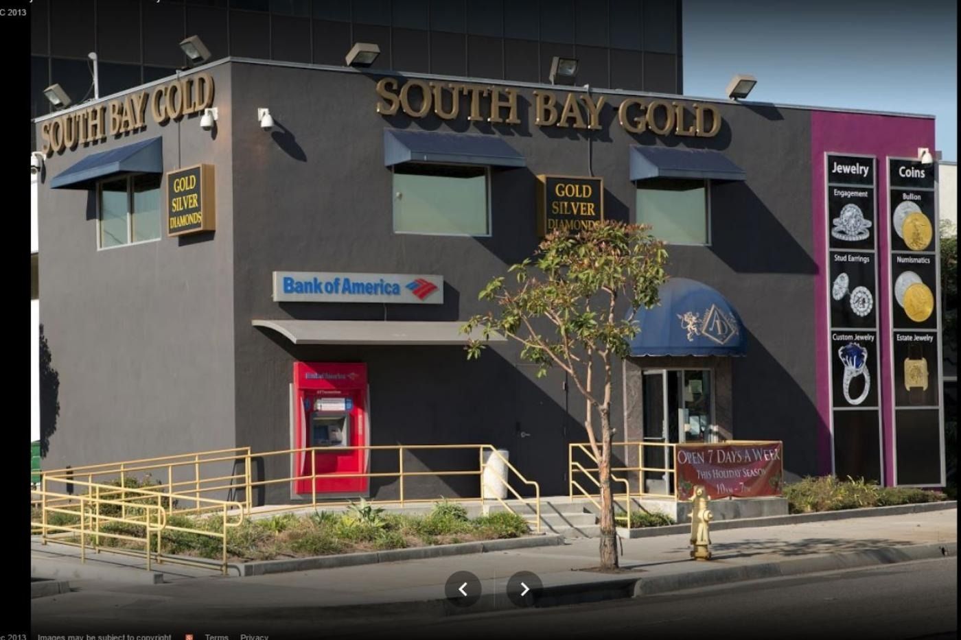 South Bay Gold storefront with Bank of America ATM, featuring gold jewelry ads. Gray building, dark facade.