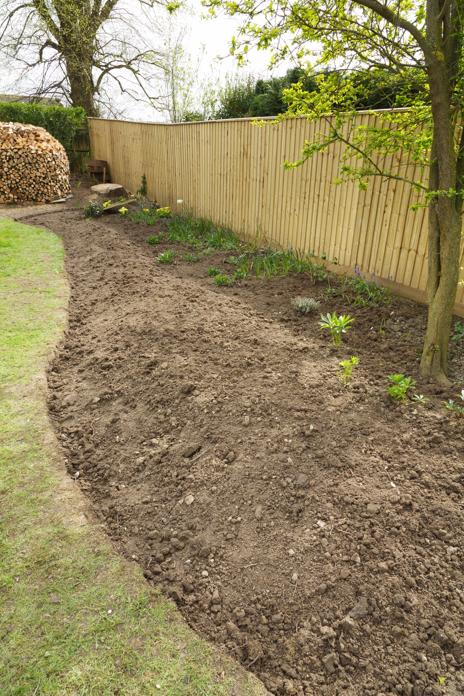 A small rake tilling soil