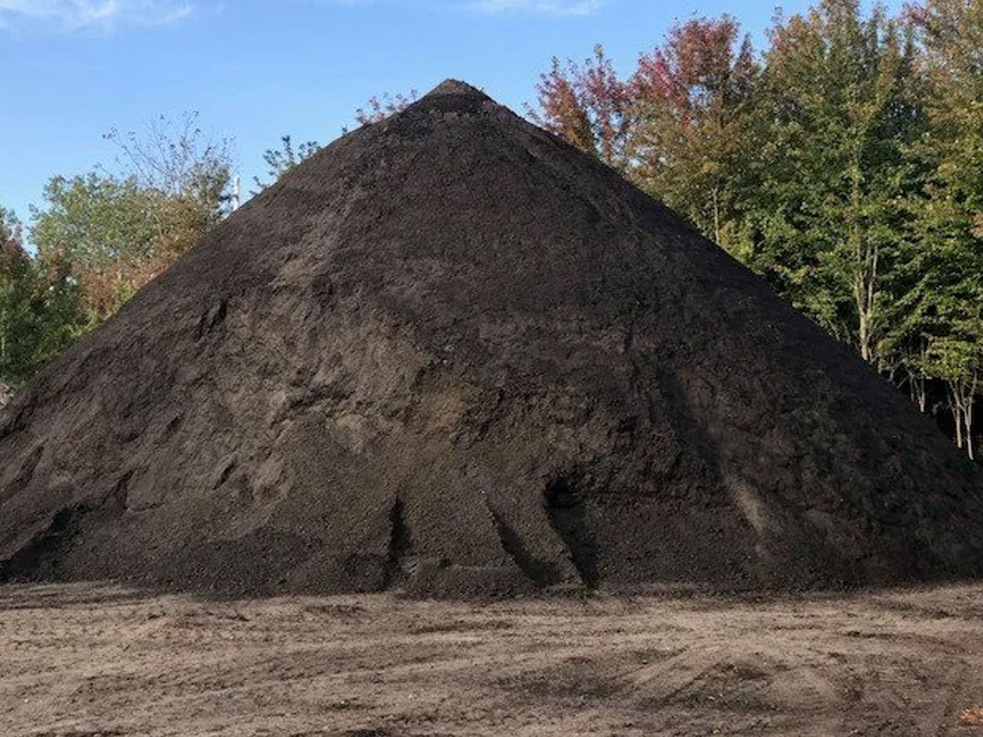 Fresh soil along a yard fence