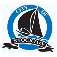 City of Stockton logo: Blue circle with black sailboat, white water, and 